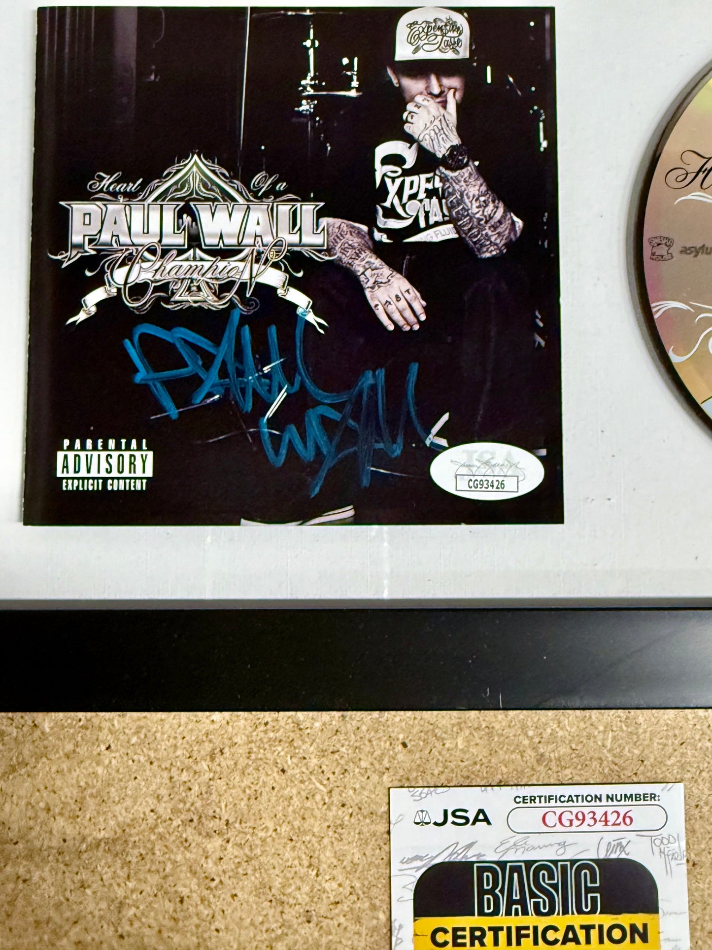 Rapper Paul Wall Signed “Heart Of A Champion” (2010) Framed CD With JSA COA