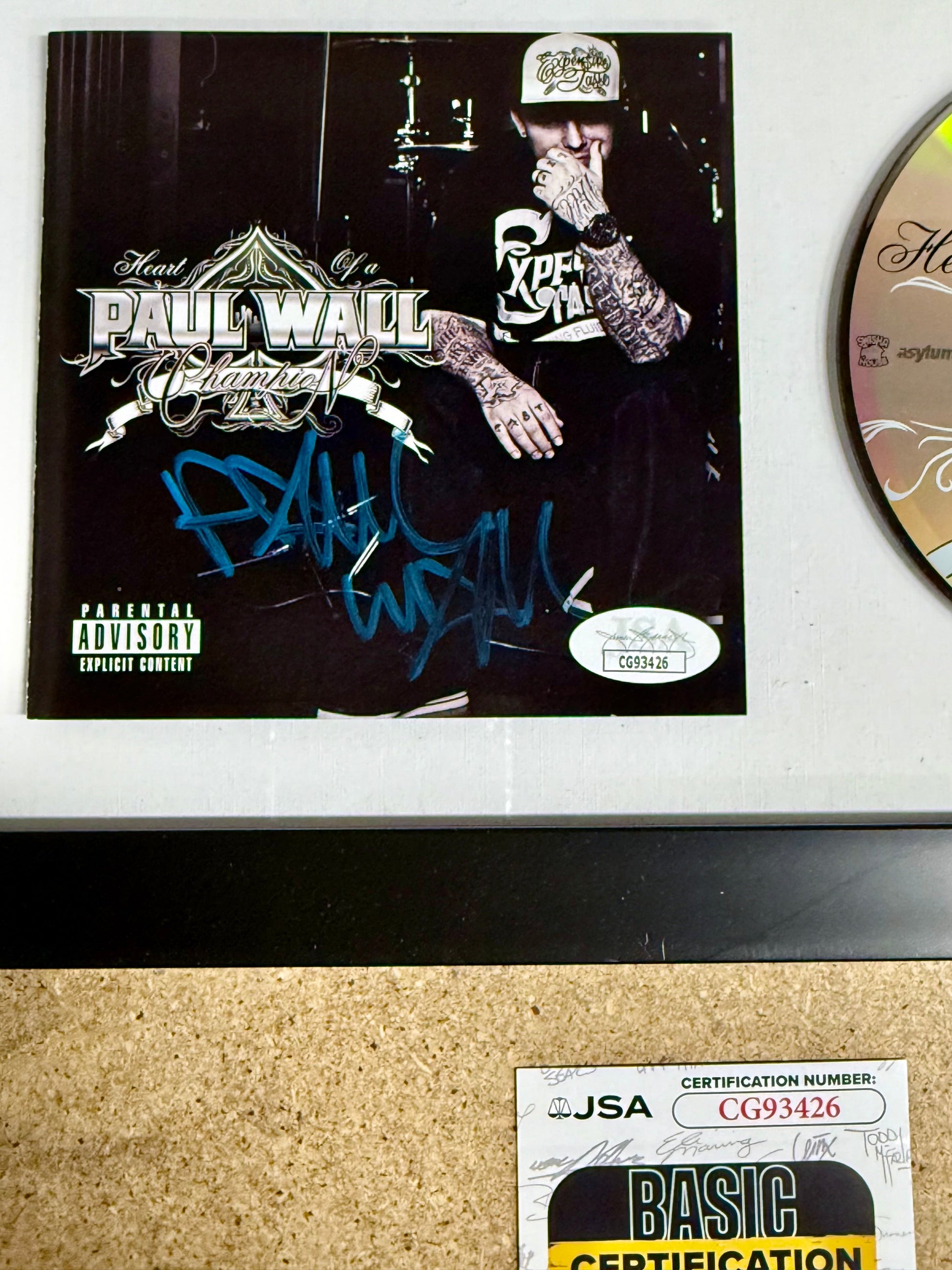Rapper Paul Wall Signed “Heart Of A Champion” (2010) Framed CD With JSA COA